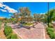 Charming community area featuring a gazebo surrounded by brick pathways and manicured green spaces at 3204 Romanesque Art Ave, Henderson, NV 89044