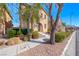 Two-story home with stucco exterior with well maintained landscaping at 3204 Romanesque Art Ave, Henderson, NV 89044