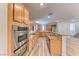 Well-equipped kitchen with a double oven, granite countertops, and stainless steel appliances at 3204 Romanesque Art Ave, Henderson, NV 89044