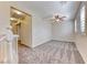 A large, open room featuring carpet flooring, ceiling fan, recessed lighting and plantation shutters at 3204 Romanesque Art Ave, Henderson, NV 89044