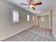 Living room features carpet flooring, a ceiling fan, recessed lighting and plantation shutters at 3204 Romanesque Art Ave, Henderson, NV 89044