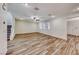 Wood-look tile flooring spans the living room, offering style and easy maintenance at 3204 Romanesque Art Ave, Henderson, NV 89044