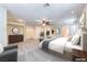 Serene main bedroom featuring soft carpeting, a ceiling fan, and ample closet space for optimal storage at 3204 Romanesque Art Ave, Henderson, NV 89044