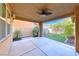 Covered patio overlooks a small yard with artificial grass at 3204 Romanesque Art Ave, Henderson, NV 89044