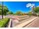 Inviting town square with brick paving, shade structures, landscaping, and pedestrian access for community gatherings at 3204 Romanesque Art Ave, Henderson, NV 89044