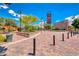 Picturesque town square with brick-paved plaza, tower feature, greenery, and pedestrian-friendly design at 3204 Romanesque Art Ave, Henderson, NV 89044