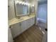 Bathroom featuring a double vanity with white cabinets and bright lighting at 3304 Michelangelo Ct, Las Vegas, NV 89129