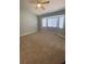 Bedroom featuring a bay window, ceiling fan, and neutral carpeting at 3304 Michelangelo Ct, Las Vegas, NV 89129