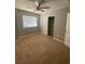 Bedroom featuring a ceiling fan, window, and closet with a white door at 3304 Michelangelo Ct, Las Vegas, NV 89129