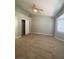 Bedroom featuring a window, ceiling fan, and closet with a white door at 3304 Michelangelo Ct, Las Vegas, NV 89129