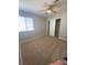 Bedroom showcasing a ceiling fan, window, and closet with a white door at 3304 Michelangelo Ct, Las Vegas, NV 89129