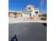 Charming two-story home with stucco exterior, desert landscaping, and a two-car garage at 3304 Michelangelo Ct, Las Vegas, NV 89129