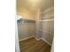 Walk-in closet offering ample storage space with shelving and a rod at 3304 Michelangelo Ct, Las Vegas, NV 89129