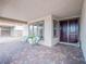 Inviting front porch with brick pavers, cozy seating, and an elegant double-door entrance at 3503 Luca Point Ave, Henderson, NV 89044