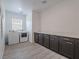 Bright laundry room featuring modern washer and dryer, with ample countertop space and stylish cabinetry at 3503 Luca Point Ave, Henderson, NV 89044