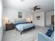 Spacious main bedroom with a large bed, soft blue accents, and neutral carpet at 3503 Luca Point Ave, Henderson, NV 89044