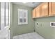 Convenient laundry room with storage and a window at 3658 Ambergate Ct, Las Vegas, NV 89147