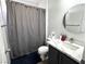 Bathroom features a toilet, marble counter, and a shower curtain at 3751 Morning Canyon St, Las Vegas, NV 89147