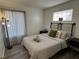 Bright bedroom with a comfortable bed, stylish lighting, and modern accents at 3751 Morning Canyon St, Las Vegas, NV 89147