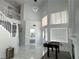 Bright living room featuring a soaring ceiling, marble floors and modern lighting at 3751 Morning Canyon St, Las Vegas, NV 89147