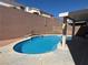 This backyard features a refreshing pool with clear blue water, perfect for relaxation and fun at 3751 Morning Canyon St, Las Vegas, NV 89147