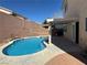 This backyard oasis has a pool, covered patio, and privacy walls at 3751 Morning Canyon St, Las Vegas, NV 89147