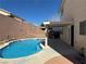 This backyard oasis has a pool, covered patio, and privacy walls at 3751 Morning Canyon St, Las Vegas, NV 89147