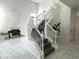 A staircase with white risers, modern decor, and a foosball table at 3751 Morning Canyon St, Las Vegas, NV 89147