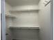 An empty walk-in closet with shelving and laminate flooring at 3751 Morning Canyon St, Las Vegas, NV 89147