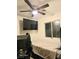 Bedroom features a ceiling fan and a modern wall mounted tv at 4006 Morning Peace St, Las Vegas, NV 89115