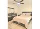 Bedroom with dark wood furniture and a ceiling fan with integrated lighting at 4006 Morning Peace St, Las Vegas, NV 89115