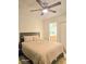 Bedroom features a ceiling fan and doorways that lead to other rooms at 4006 Morning Peace St, Las Vegas, NV 89115