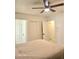 Bedroom with ceiling fan and doorways that lead to other rooms at 4006 Morning Peace St, Las Vegas, NV 89115