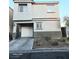 Two-story home featuring desert landscaping, an attached garage, and neutral color palette at 4006 Morning Peace St, Las Vegas, NV 89115