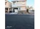 View of two-story home featuring desert landscaping, an attached garage, and neutral color palette at 4006 Morning Peace St, Las Vegas, NV 89115