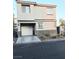 Two-story home featuring desert landscaping, an attached garage, and neutral color palette at 4006 Morning Peace St, Las Vegas, NV 89115