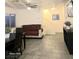 Living room with dark dining table and staircase at 4006 Morning Peace St, Las Vegas, NV 89115