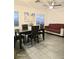 Living room with dining table, sofa and natural light at 4006 Morning Peace St, Las Vegas, NV 89115