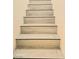 Staircase featuring wood-look tile steps with black front trim at 4006 Morning Peace St, Las Vegas, NV 89115