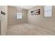 Neutral bedroom features carpet, natural light, and modern decor at 4340 Hatch Bend Ave, North Las Vegas, NV 89031