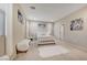 Serene bedroom featuring white furniture, plush textures, and soft lighting, creating a tranquil retreat at 4340 Hatch Bend Ave, North Las Vegas, NV 89031