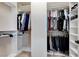 Organized walk-in closet with ample hanging space, shelving, and compartments, providing storage for clothing and accessories at 4340 Hatch Bend Ave, North Las Vegas, NV 89031