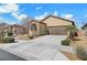 Charming single-story home with a two-car garage and desert landscaping at 4340 Hatch Bend Ave, North Las Vegas, NV 89031