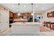 Well-lit kitchen featuring stainless steel appliances, granite countertops, and an extended island at 4340 Hatch Bend Ave, North Las Vegas, NV 89031