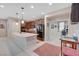 Spacious kitchen featuring an island with stone countertops and seamlessly connect to other rooms at 4340 Hatch Bend Ave, North Las Vegas, NV 89031