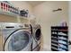 Laundry room with washer, dryer, and shoe rack at 4340 Hatch Bend Ave, North Las Vegas, NV 89031