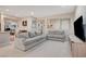 Bright living room offering neutral decor, sofas, and an adjacent eating area at 4340 Hatch Bend Ave, North Las Vegas, NV 89031