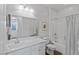 Bathroom featuring a single sink vanity with a quartz countertop, toilet, and shower-tub combination at 436 Trevinca St, Las Vegas, NV 89138