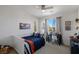 Comfortable bedroom featuring a ceiling fan, window with curtains, and desk for a functional and inviting space at 436 Trevinca St, Las Vegas, NV 89138