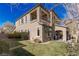 Spacious two-story home featuring a well-manicured lawn and a charming covered patio area at 436 Trevinca St, Las Vegas, NV 89138